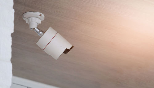 High angle view of electric lamp on wall