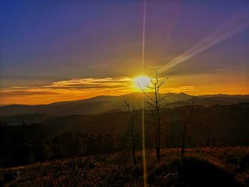 Scenic view of silhouette landscape against sky during sunset