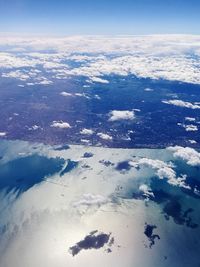 Aerial view of white clouds over landscape