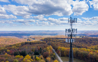 Scenic view of communications tower against sky