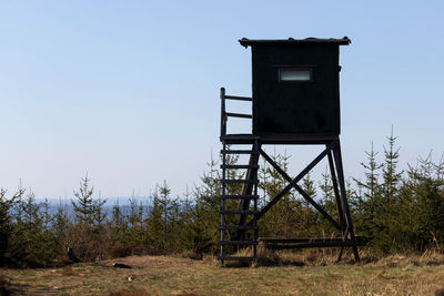 Built structure on field against clear sky