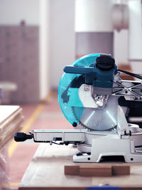 Close-up of machine part on table