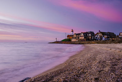 Scenic view of beach against sky during sunset