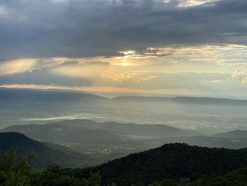 Scenic view of mountains against sky during sunset