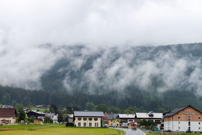 Houses and buildings against sky