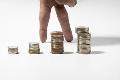 Close-up of hand holding coins