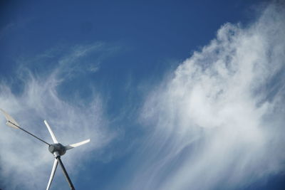Low angle view of wind turbine against sky
