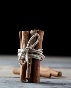 Close-up of rope tied on table