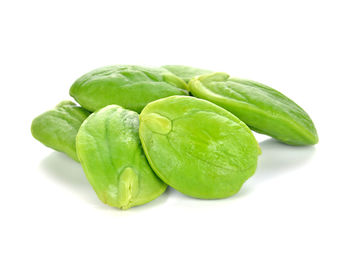 Close-up of green pepper against white background