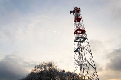 Low angle view of communications tower against sky