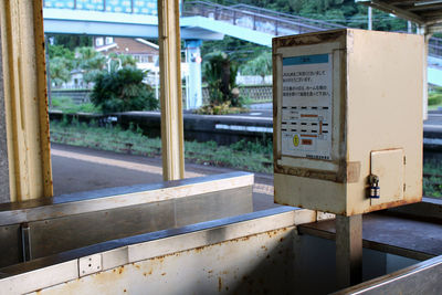 Close-up of information sign on metal structure