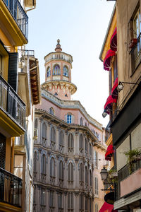 Low angle view of buildings against clear sky