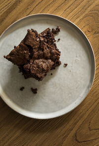 High angle view of chocolate cake in plate on table