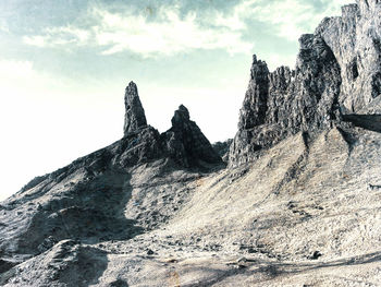 Rock formations on mountain against sky