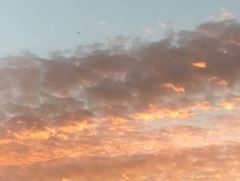 Low angle view of clouds in sky during sunset