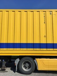 Yellow truck parked on road