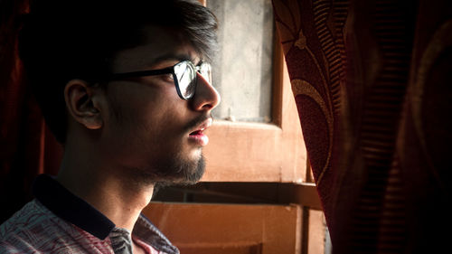 Portrait of young man looking away