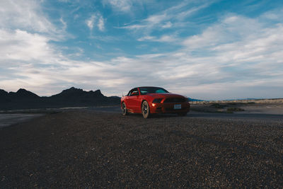 Vintage car on mountain against sky