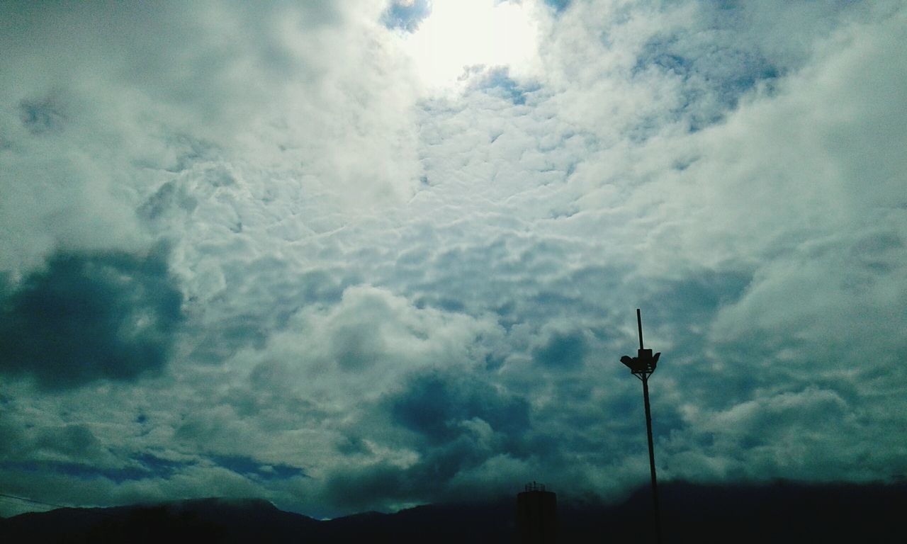 LOW ANGLE VIEW OF SILHOUETTE WIND TURBINES AGAINST SKY