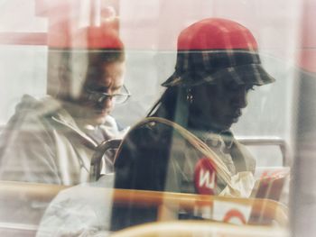 Reflection of people on glass window