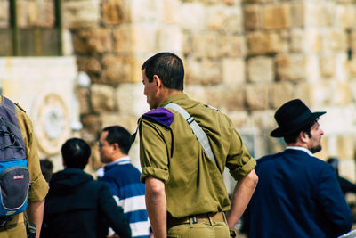 Rear view of people walking outdoors