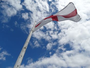 Low angle view of flag against sky