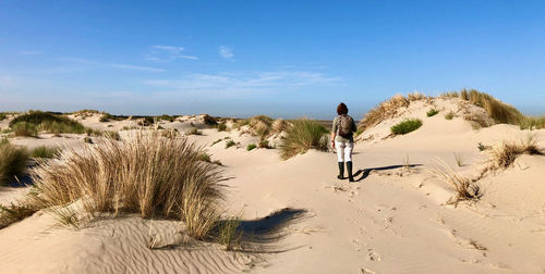 Full length of man on desert against sky