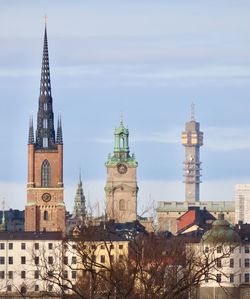 View of buildings in city against sky