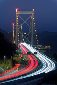 High angle view of light trails on highway at night