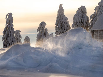 Panoramic view of snowcapped landscape against sky during winter