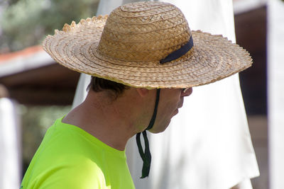 Close-up of man wearing hat