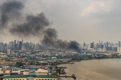 Panoramic view of buildings and city against sky