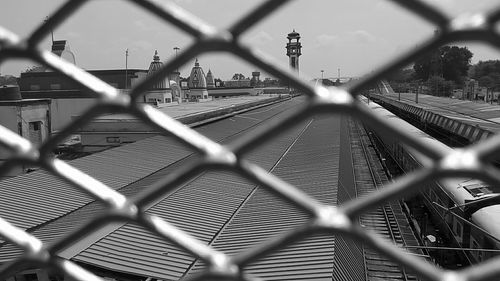 Close-up of chainlink fence against sky