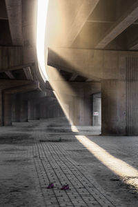 Bridge over road amidst buildings in city