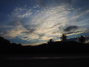 Scenic view of silhouette trees against sky during sunset