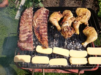 High angle view of meat on barbecue grill