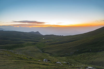 Scenic view of landscape against sky during sunset