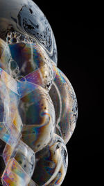 Close-up of bubbles against black background