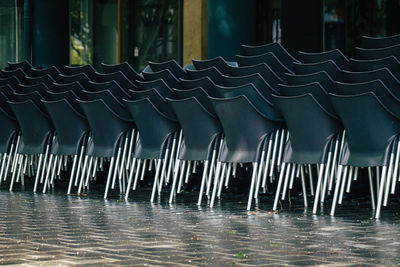 Row of metal chairs in water