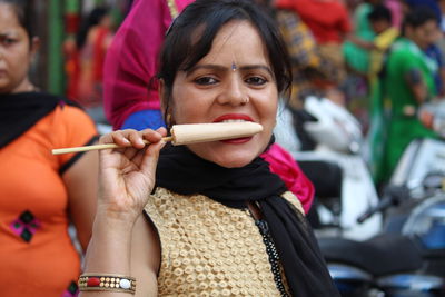 Portrait of woman eating ice cream