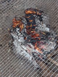 High angle view of meat on barbecue grill