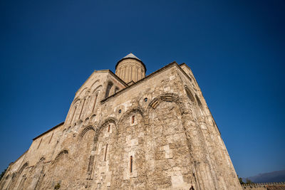 Low angle view of building against blue sky