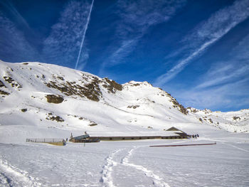 Scenic view of snowcapped mountains against sky