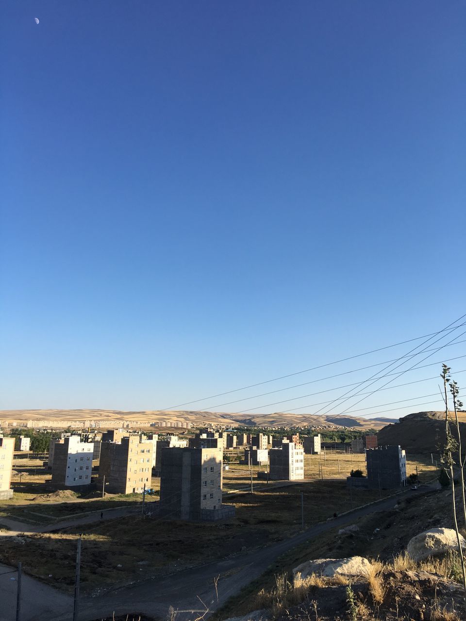 clear sky, blue, built structure, outdoors, sky, day, no people, nature, landscape, tranquility, engineering, empty, tranquil scene, sunny, scenics