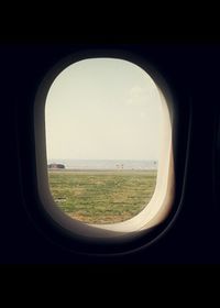 View of landscape seen through window