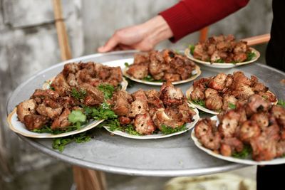 Close-up of cooked pork on  plates