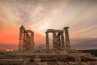 Old temple against sky during sunset