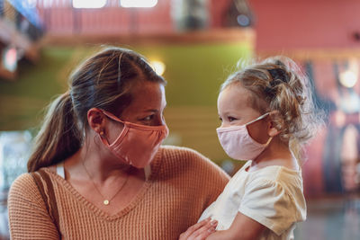 Portrait of mother and daughter outdoors