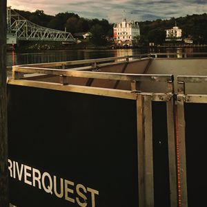 Information sign by building against sky