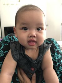 Portrait of cute baby at home